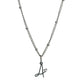 Cursive Initial necklace with heart detail in silver tone water and tarnish resistant